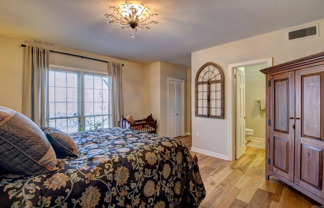 3901 Cedar Hill Rd, Little Rock, AR 72202 - bedroom featuring light wood-style floors, baseboards, and ensuite bathroom