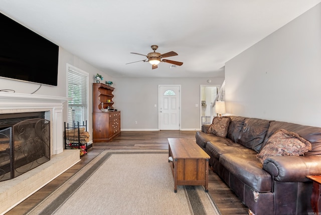 40 High Timber Dr, Maumelle, AR 72113 - living area with wood finished floors, a ceiling fan, baseboards, and a fireplace with raised hearth