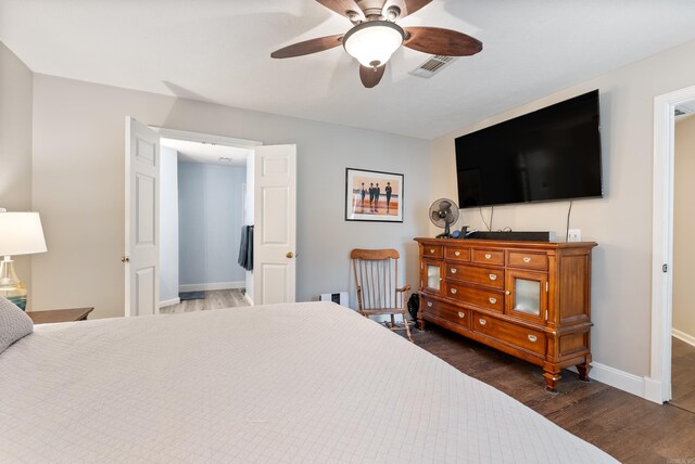 40 High Timber Dr, Maumelle, AR 72113 - bedroom featuring dark wood-style floors, baseboards, and a ceiling fan