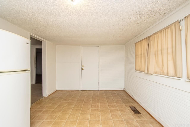 1523 W 46, North Little Rock, AR 72118 - unfurnished room with a textured ceiling