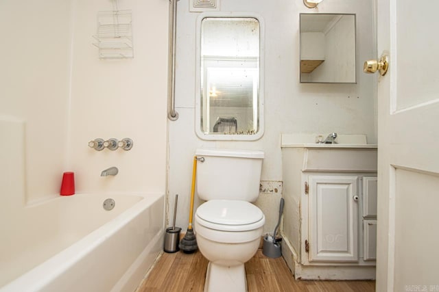 1523 W 46, North Little Rock, AR 72118 - full bathroom featuring toilet, wood finished floors, vanity, and bathing tub / shower combination