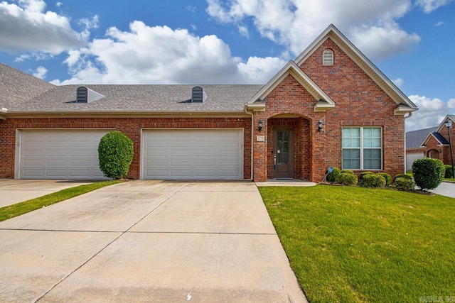 425 Valley Ranch Cir, Little Rock, AR 72223 - view of front of property featuring brick siding, a front lawn, concrete driveway, and a shingled roof