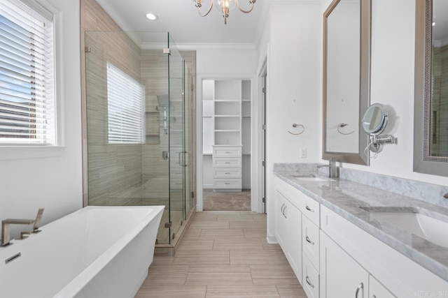 425 Valley Ranch Cir, Little Rock, AR 72223 - full bath featuring a stall shower, crown molding, a freestanding bath, double vanity, and a spacious closet