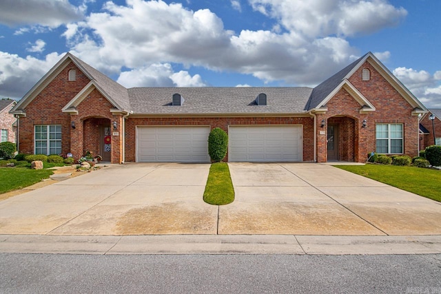 425 Valley Ranch Cir, Little Rock, AR 72223 - traditional-style house featuring brick siding, a shingled roof, driveway, a garage, and a front lawn