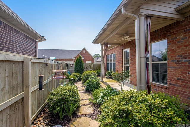 425 Valley Ranch Cir, Little Rock, AR 72223 - fenced backyard with ceiling fan and a patio area