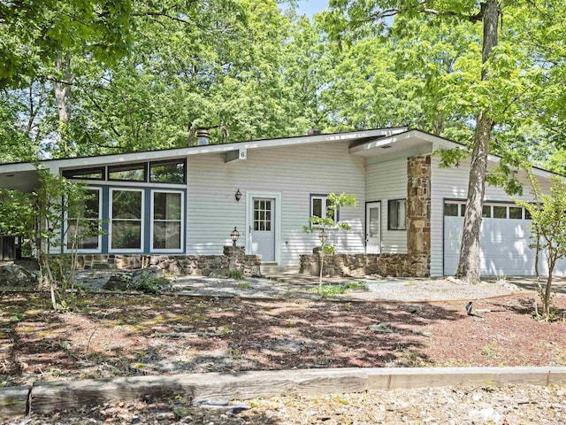 6 Sierra Ln, Hot Springs Village, AR 71909 - back of property with an attached garage and stone siding