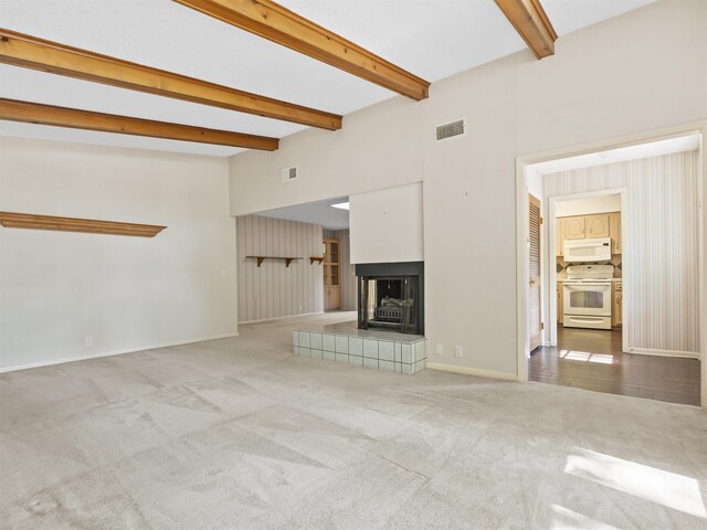 6 Sierra Ln, Hot Springs Village, AR 71909 - unfurnished living room with carpet, beamed ceiling, a fireplace, and baseboards