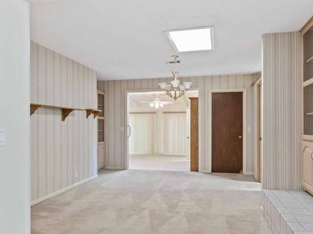 6 Sierra Ln, Hot Springs Village, AR 71909 - unfurnished dining area featuring wallpapered walls, a chandelier, and light carpet