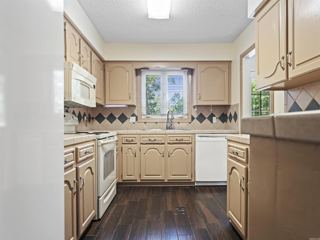 6 Sierra Ln, Hot Springs Village, AR 71909 - kitchen featuring white appliances, tile counters, dark wood-style flooring, a sink, and decorative backsplash
