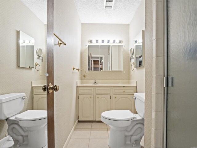 6 Sierra Ln, Hot Springs Village, AR 71909 - full bathroom featuring toilet, tile patterned flooring, a textured ceiling, an enclosed shower, and vanity