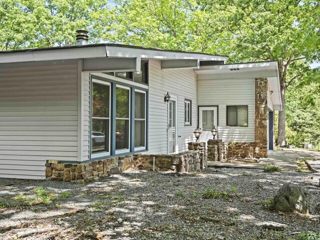 6 Sierra Ln, Hot Springs Village, AR 71909 - rear view of property featuring stone siding