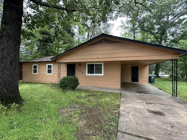 3509 Arapaho Trl, Little Rock, AR 72209 - bungalow-style house with concrete driveway, a front yard, and a carport