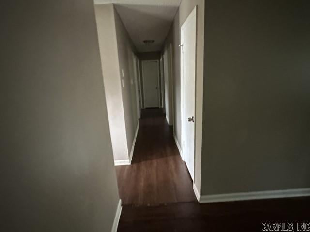 3509 Arapaho Trl, Little Rock, AR 72209 - hall featuring baseboards and dark wood-style floors