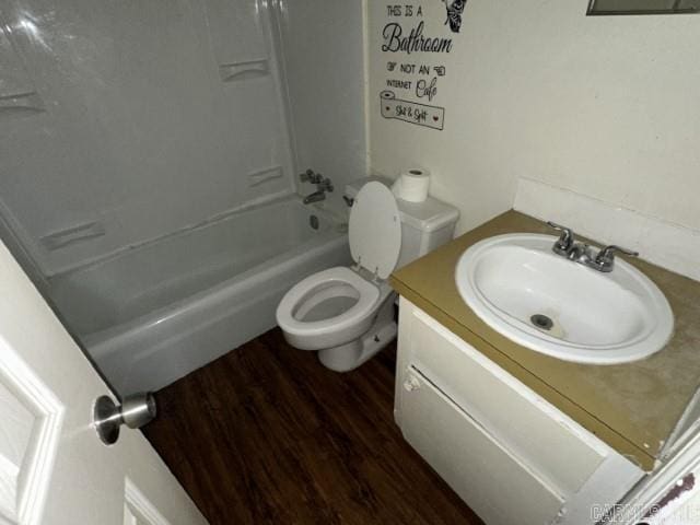 3509 Arapaho Trl, Little Rock, AR 72209 - bathroom featuring toilet, vanity, wood finished floors, and shower / bathtub combination
