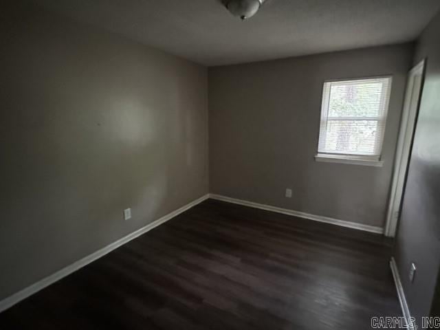 3509 Arapaho Trl, Little Rock, AR 72209 - empty room with dark wood finished floors and baseboards