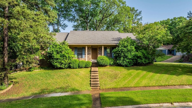 2102 Peach Tree Dr, Little Rock, AR 72211 - obstructed view of property with a front yard, a shingled roof, and a porch