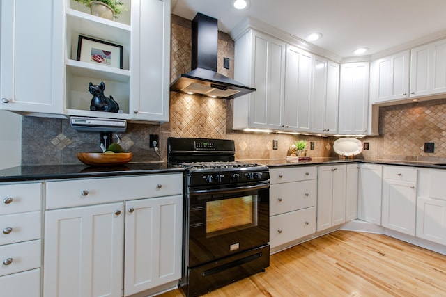 6220 Hopi Dr, North Little Rock, AR 72116 - kitchen with wall chimney exhaust hood, black range with gas stovetop, dark countertops, white cabinetry, and light wood-type flooring