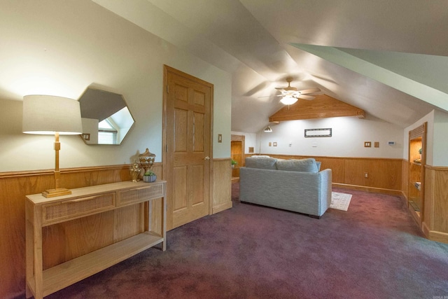 6220 Hopi Dr, North Little Rock, AR 72116 - additional living space featuring a wainscoted wall, vaulted ceiling, wooden walls, ceiling fan, and carpet