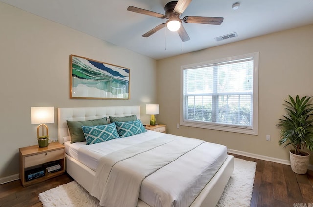 6220 Hopi Dr, North Little Rock, AR 72116 - bedroom with baseboards, wood finished floors, and a ceiling fan