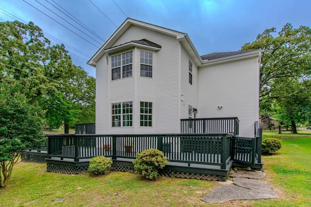 6220 Hopi Dr, North Little Rock, AR 72116 - rear view of property featuring a lawn and a wooden deck