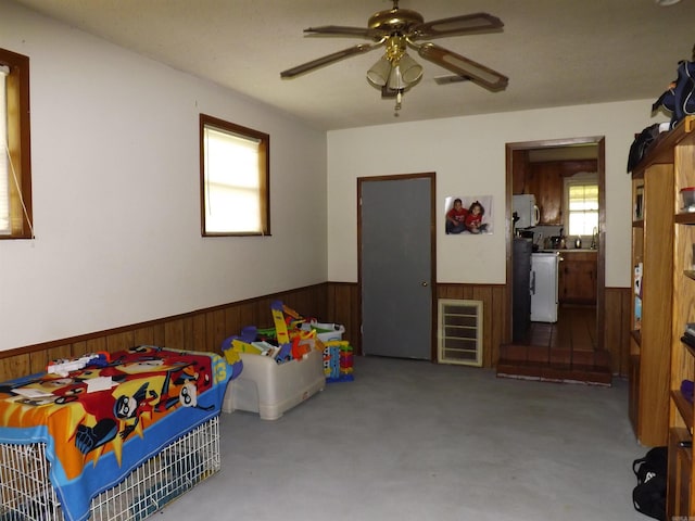 1020 Pioneer Rd, Searcy, AR 72143 - game room with wainscoting, wooden walls, a ceiling fan, and carpet