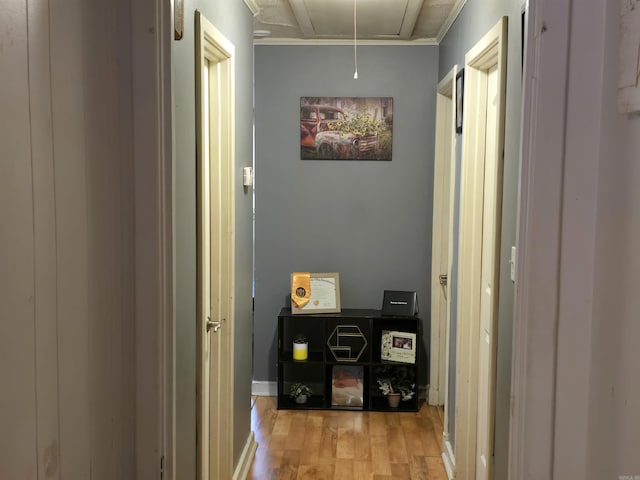 1020 Pioneer Rd, Searcy, AR 72143 - hallway with attic access, wood finished floors, crown molding, and baseboards