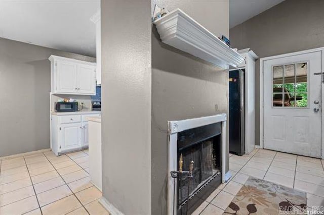 503 Westpine Dr, Hot Springs, AR 71913 - unfurnished living room featuring light tile patterned floors and a fireplace