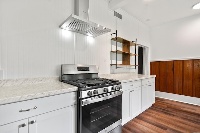 169 Crest St, Hot Springs, AR 71901 - kitchen featuring exhaust hood, gas stove, dark wood finished floors, white cabinets, and wooden walls