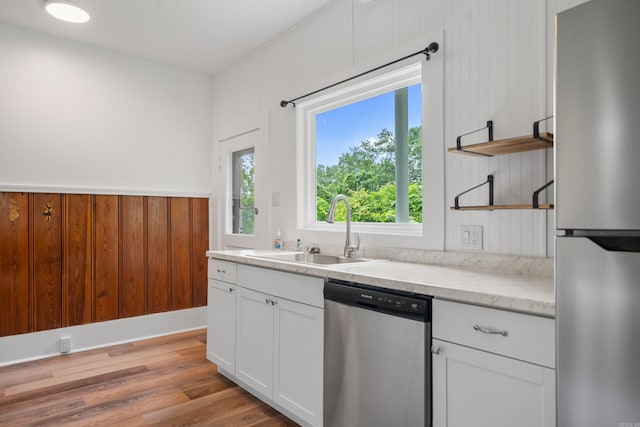 169 Crest St, Hot Springs, AR 71901 - kitchen featuring stainless steel appliances, a sink, open shelves, white cabinetry, and light wood finished floors