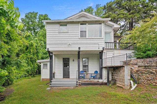169 Crest St, Hot Springs, AR 71901 - back of property with covered porch and a lawn