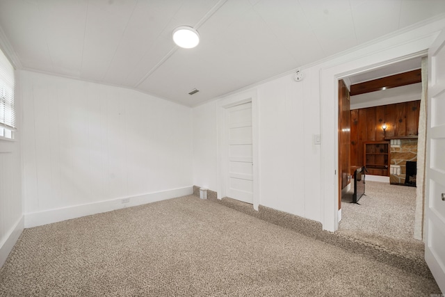169 Crest St, Hot Springs, AR 71901 - carpeted empty room with wood walls and baseboards