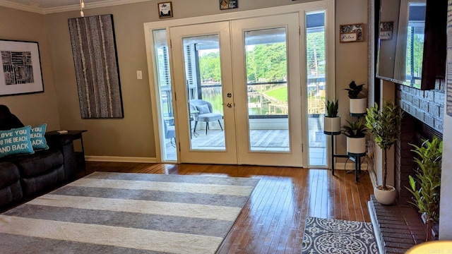 1201 Airport Rd Unit C12, Hot Springs, AR 71913 - doorway to outside with crown molding, wood-type flooring, french doors, baseboards, and a brick fireplace