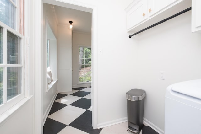 3501 Oakwood Rd Unit 9, Little Rock, AR 72202 - hallway featuring tile patterned floors, washer / dryer, and ornamental molding