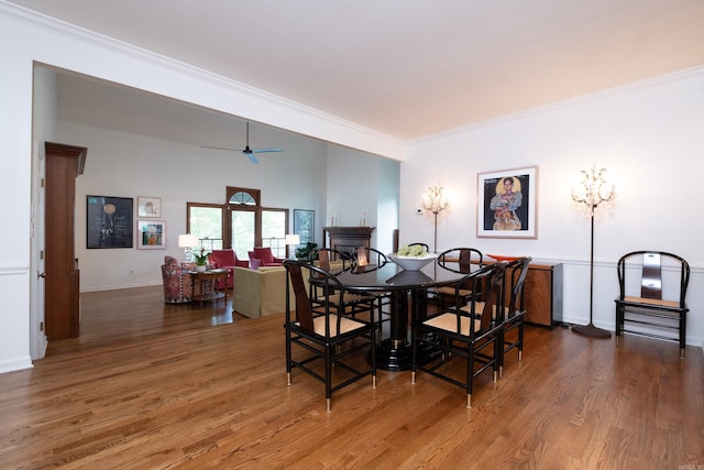 3501 Oakwood Rd Unit 9, Little Rock, AR 72202 - dining space with wood finished floors, ornamental molding, ceiling fan, and baseboards