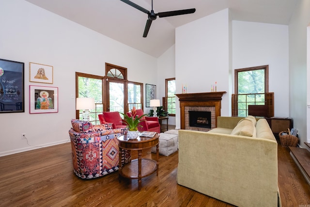 3501 Oakwood Rd Unit 9, Little Rock, AR 72202 - living area with high vaulted ceiling, ceiling fan, wood finished floors, baseboards, and a fireplace