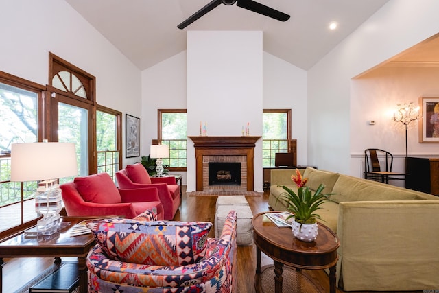 3501 Oakwood Rd Unit 9, Little Rock, AR 72202 - living room with wood finished floors, ceiling fan, high vaulted ceiling, a brick fireplace, and healthy amount of natural light