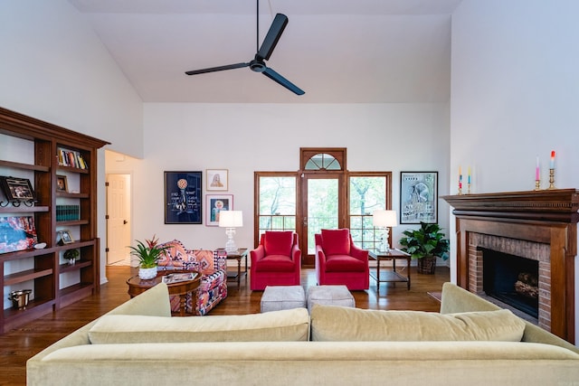 3501 Oakwood Rd Unit 9, Little Rock, AR 72202 - living area with a fireplace, a ceiling fan, dark wood-type flooring, and lofted ceiling