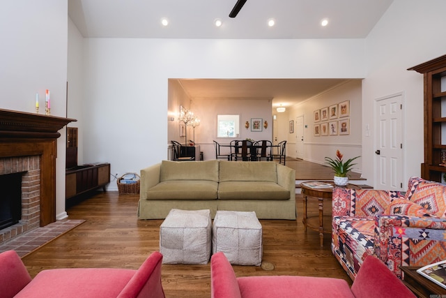 3501 Oakwood Rd Unit 9, Little Rock, AR 72202 - living area featuring wood finished floors, a brick fireplace, and recessed lighting