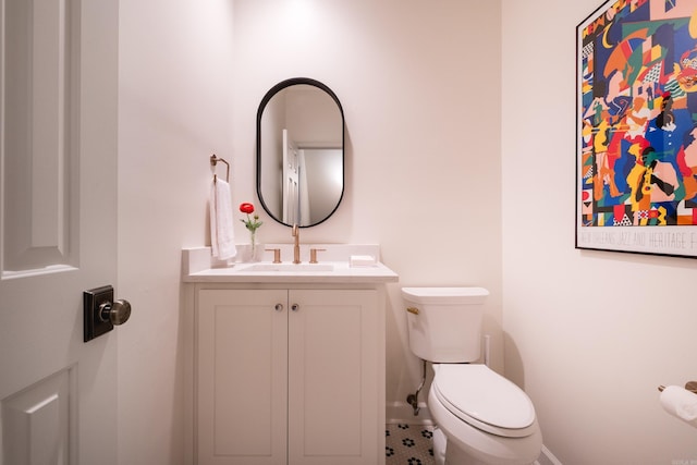 3501 Oakwood Rd Unit 9, Little Rock, AR 72202 - half bathroom with toilet, vanity, and baseboards