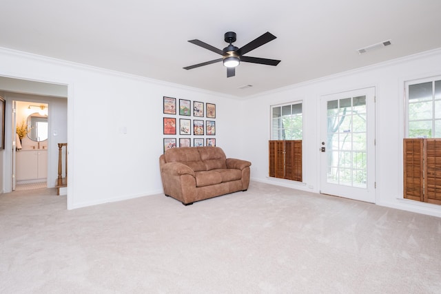 3501 Oakwood Rd Unit 9, Little Rock, AR 72202 - sitting room with crown molding, a ceiling fan, healthy amount of natural light, and carpet flooring