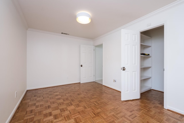 3501 Oakwood Rd Unit 9, Little Rock, AR 72202 - unfurnished bedroom featuring ornamental molding, baseboards, and a walk in closet
