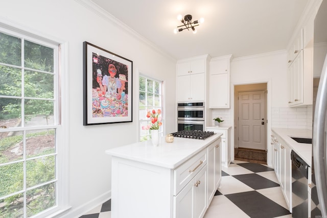 3501 Oakwood Rd Unit 9, Little Rock, AR 72202 - kitchen featuring light flooring, stainless steel appliances, decorative backsplash, light countertops, and white cabinets