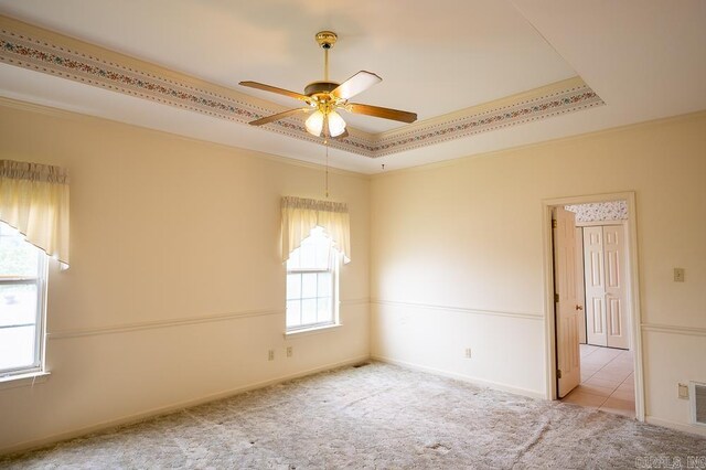 4 Hunter Ct, Little Rock, AR 72211 - carpeted empty room featuring a ceiling fan, a tray ceiling, crown molding, and baseboards
