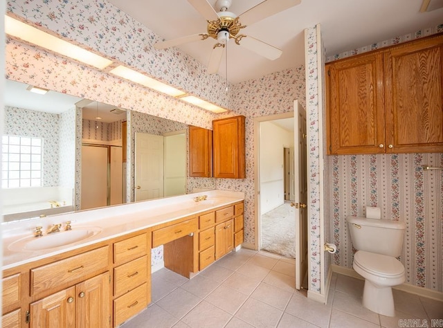 4 Hunter Ct, Little Rock, AR 72211 - bathroom with tile patterned flooring, a stall shower, wallpapered walls, ceiling fan, and toilet