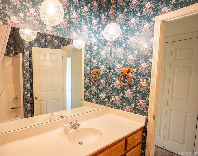4 Hunter Ct, Little Rock, AR 72211 - bathroom featuring wallpapered walls, vanity, and  shower combination