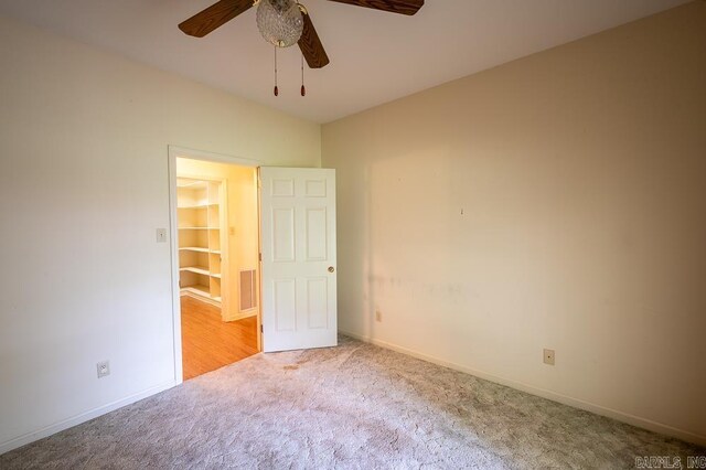 4 Hunter Ct, Little Rock, AR 72211 - unfurnished bedroom with carpet, baseboards, and a ceiling fan