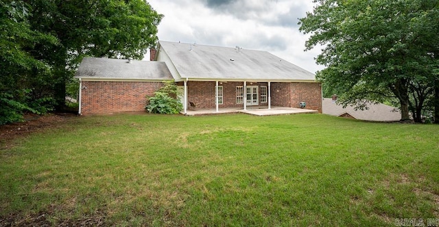 4 Hunter Ct, Little Rock, AR 72211 - rear view of property with a patio, a lawn, and brick siding