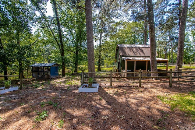 9425 Hogue Rd, Mabelvale, AR 72103 - view of yard with an outbuilding and an exterior structure