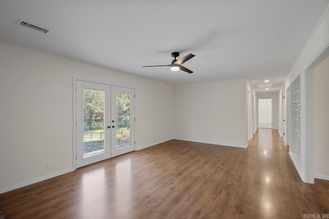 9425 Hogue Rd, Mabelvale, AR 72103 - unfurnished room featuring french doors, wood finished floors, ceiling fan, baseboards, and recessed lighting