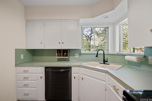 9425 Hogue Rd, Mabelvale, AR 72103 - kitchen with dishwashing machine, a sink, light countertops, white cabinets, and range